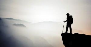 Silhouette of hiking man in mountain